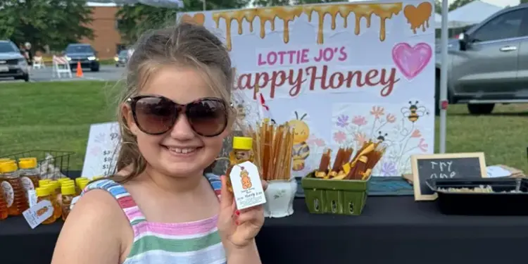"Lottie Jo's Happy Honey" stand during the 2024 Hampstead Young Entrepreneur Holiday Expo