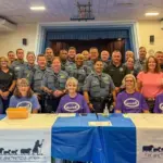- Carroll News | Carroll Publications | Carroll County, MD Group photo of sheriff's deputies and volunteers at a community event behind a table with The Shepherd's Staff banners in a gym setting