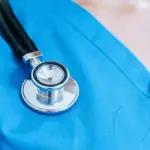 carrol-news-feature-image-health - Carroll News | Carroll Publications | Carroll County, MD Stethoscope resting on blue medical scrubs, ready for exam.