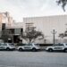 Front view of the Seminole County Courthouse with sheriff patrol cars parked along the curb in front of the building